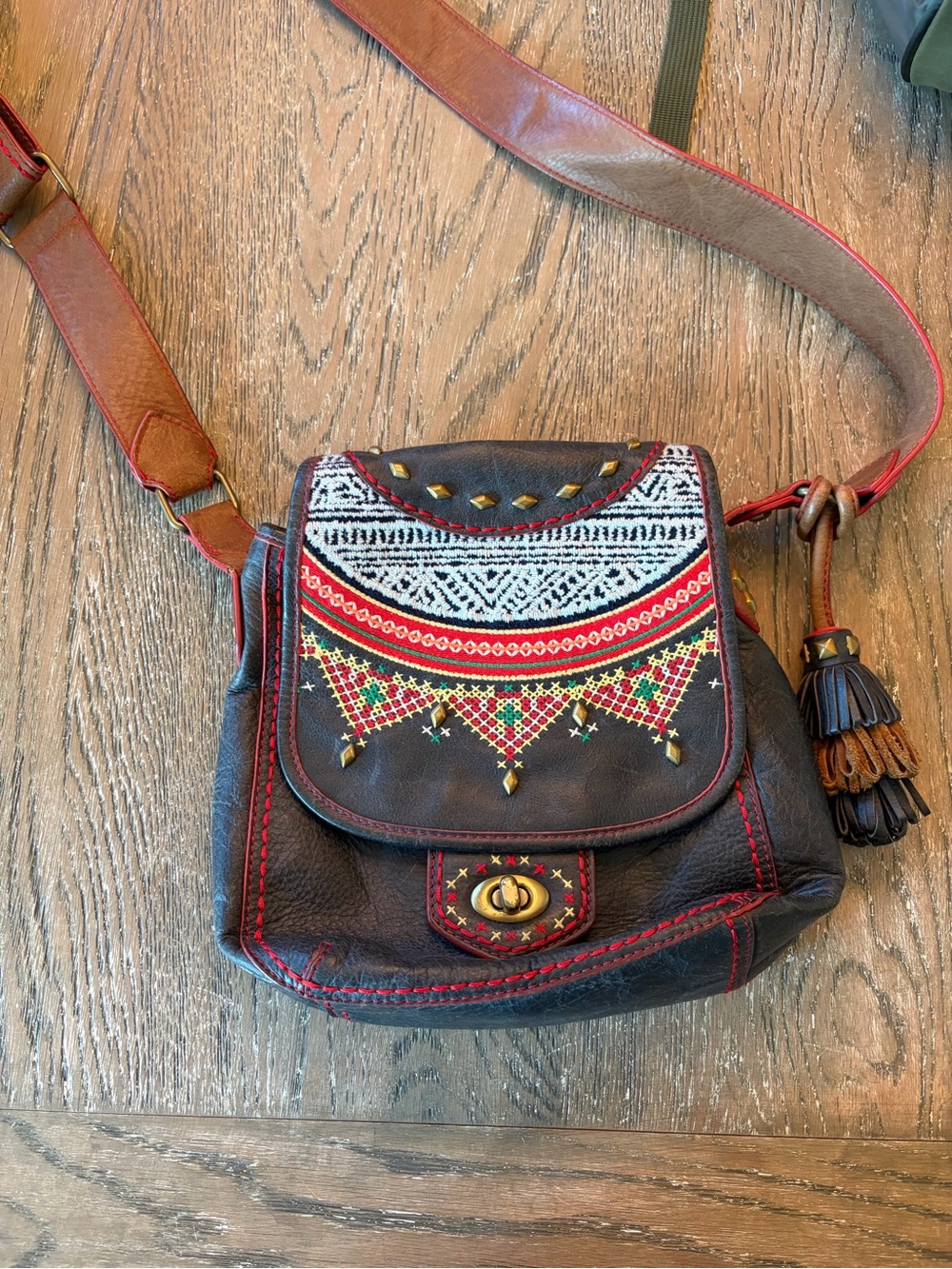Isabella Fiore Black Crossbody Bag with Red Trim and Multicolor Embroidery